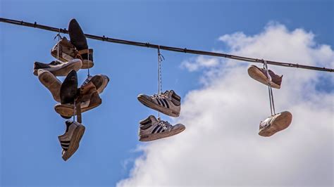 what does shoes on a power line mean